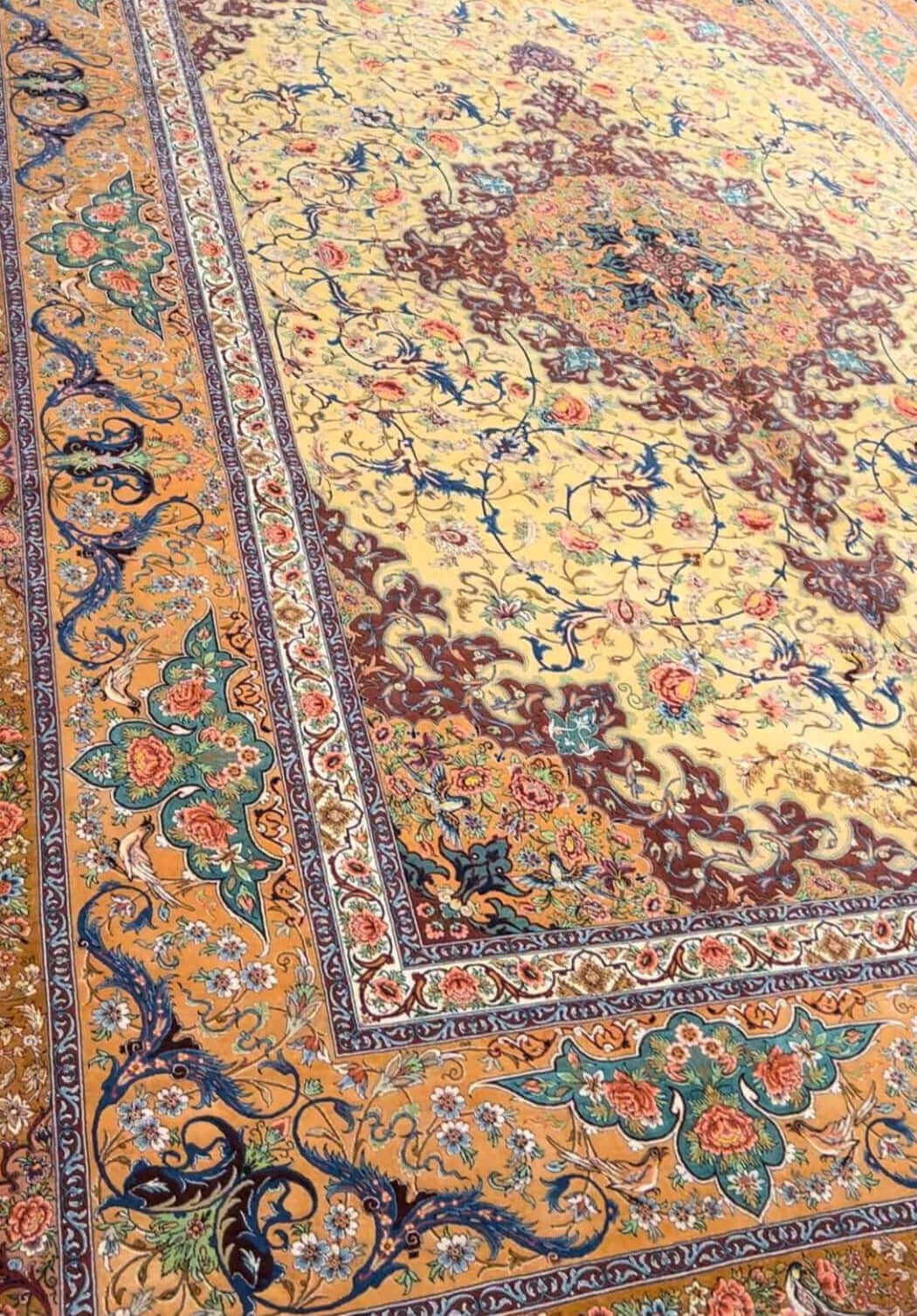 "Large 350 x 250 cm Persian rug showcasing detailed patterns and silk warp construction"